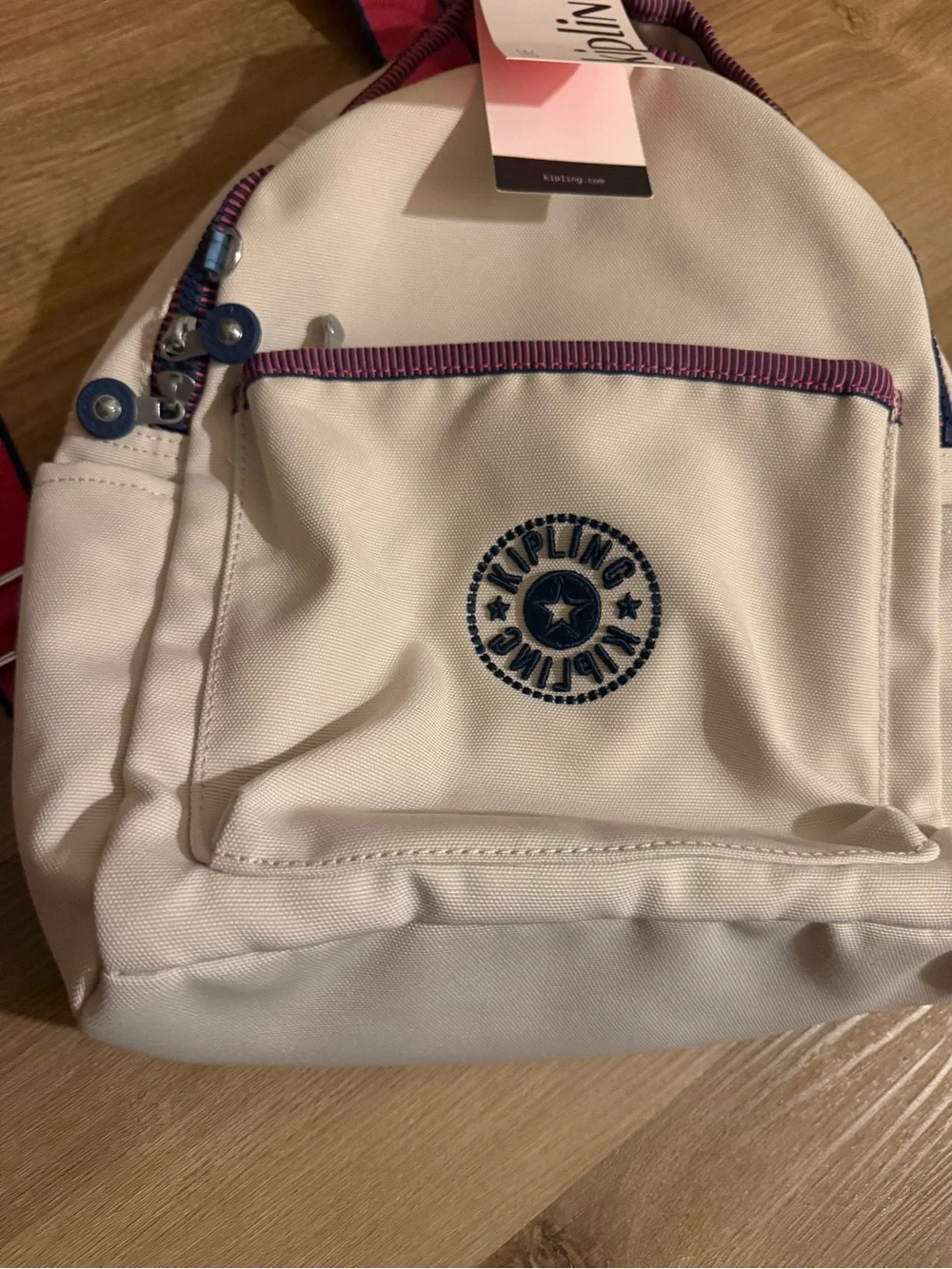 Kipling Cream Kids Backpack with Purple Trim and Blue Charm